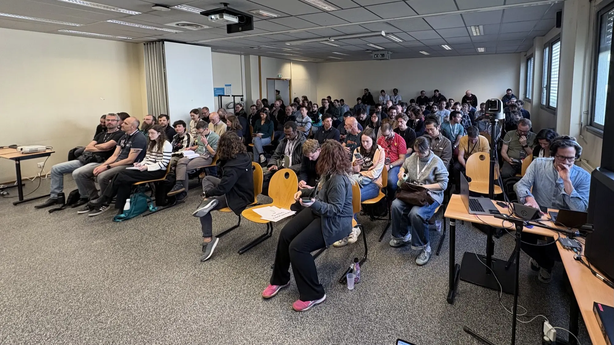 The room during the talk about the future of developers, with a lot of people standing at the back of the room